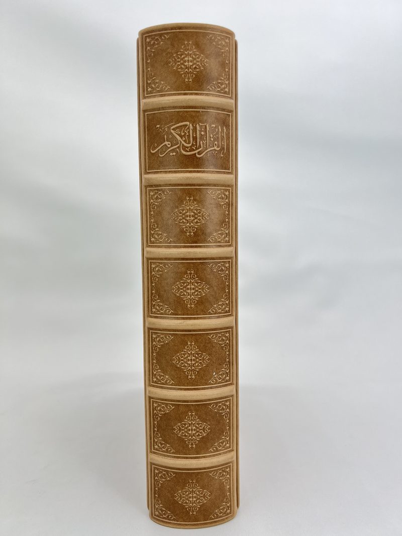 Genuine-leather spine with hand-formed raised bands and gold tooling
